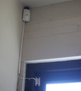 PIR sensor above a door.