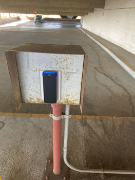 Parking garage access control reader at a security gate.