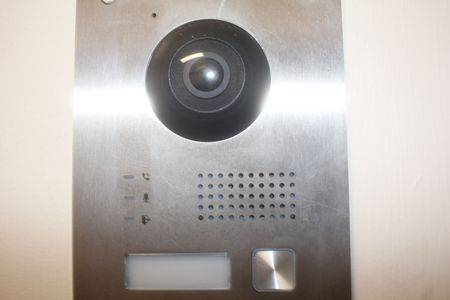 Commercial intercom system features can include cameras for a video intercom system with live video communications.