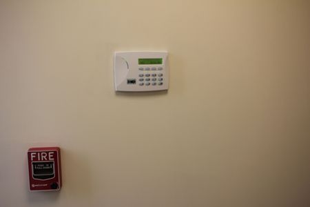 System administrator controlling access to minimize security risk with keypad.