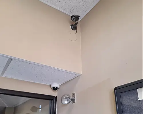 Bullet and dome security cameras for deterrence at a business lobby